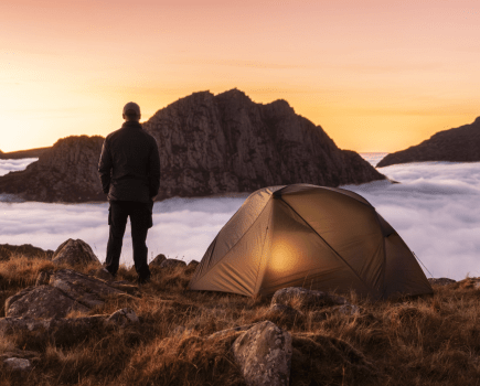 UK Three Peaks - Main image: A pitch overlooking Tryfan, Eryri/Snowdonia | Credit: Chris Homer / Shutterstock