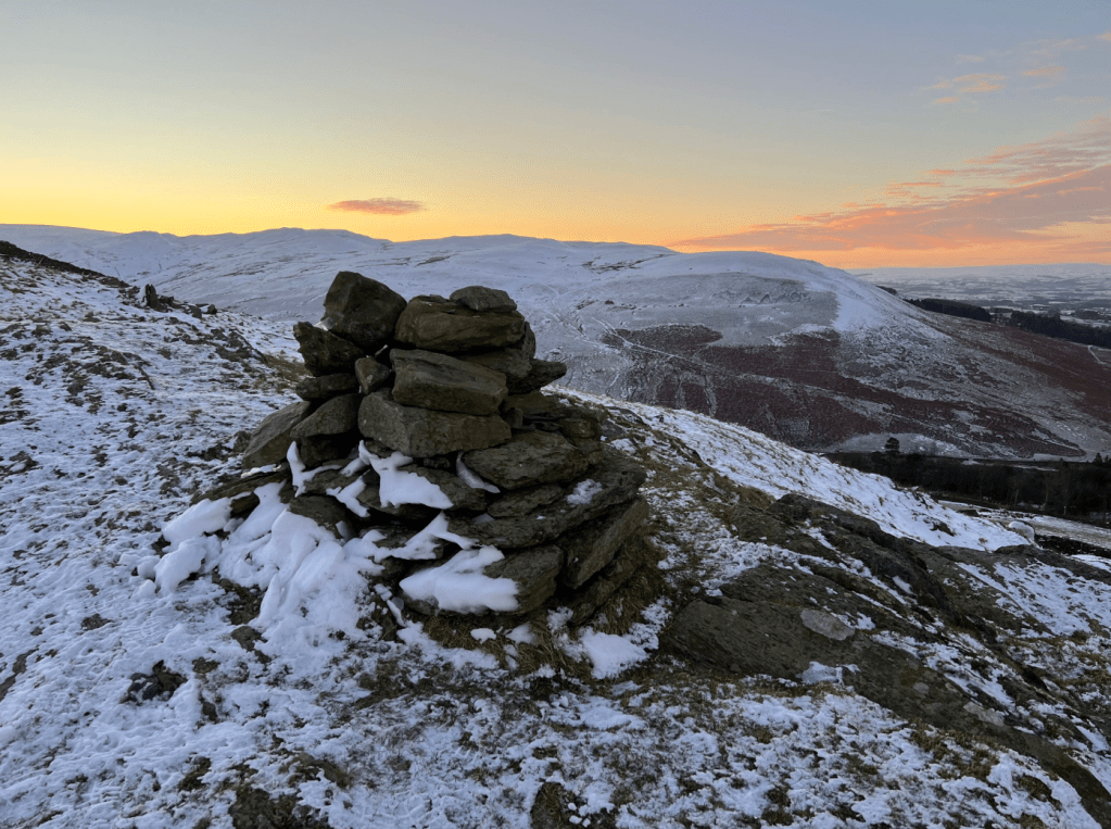 Cairn on Eskholme Pike looking to Barbon Low Fell