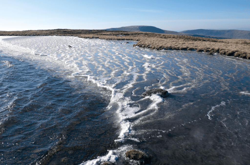 Sub-zero temperatures and the wind combine to create an unusual effect on one of the Whernside Tarns_VCROW