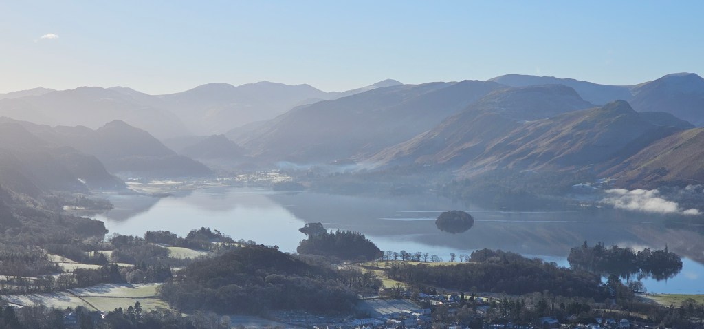 A hazy Derwentwater from the slopes of Skiddaw. Credit: Norman Hadley