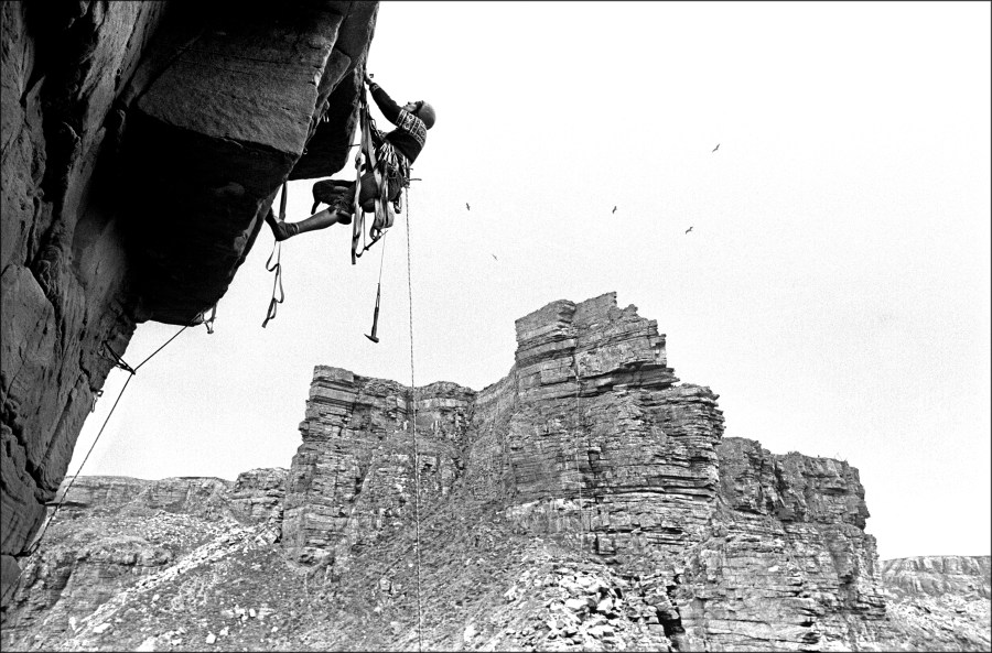 ISLE of HOY, ORKNEY :  Dougal Haston in action on the overhanging pitch of the then virgin S.E. Arete of the OLD MAN OF HOY sea-stack. 

