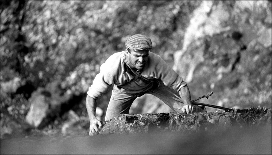 Cleare Perspectives - On DINAS GROMLECH high over the Llanberis Pass in SNOWDONIA, Rusty Baillie leads CEMETERY GATES.
