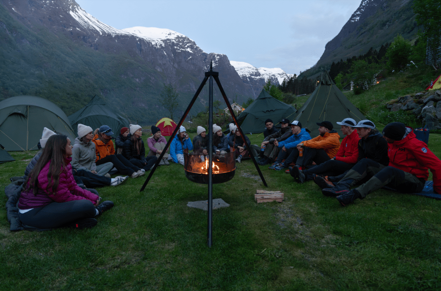 Camp fires under snow-capped summits. Credit: M Creative Studio / Helly Hansen