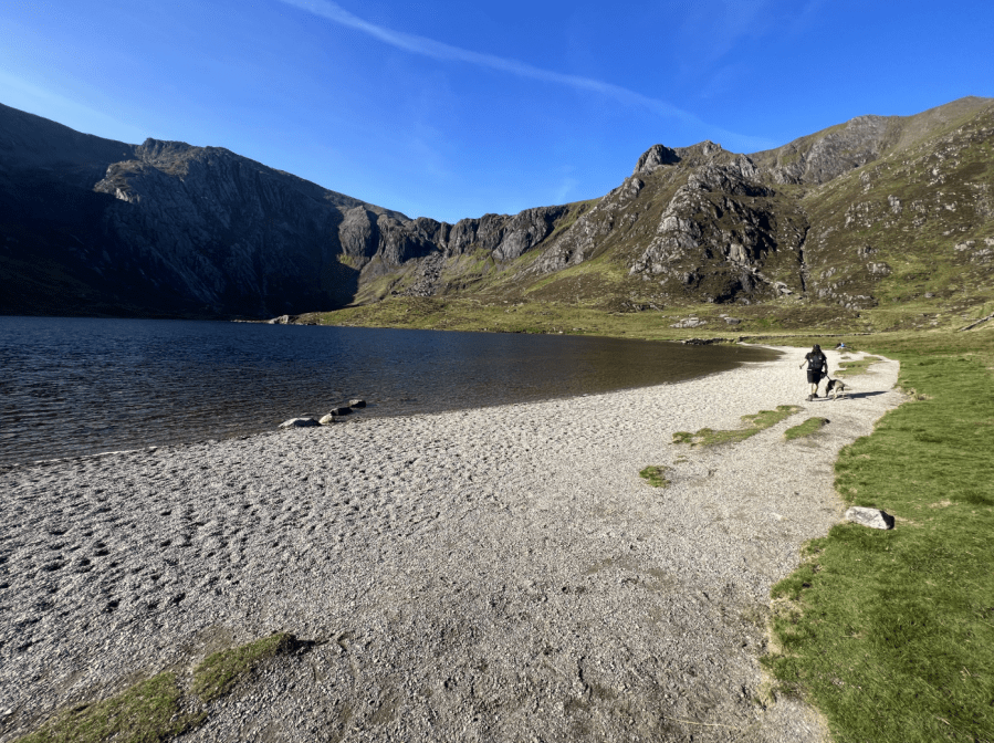 summer hiking - Walking alongside Llyn Idwal first thing in the morning - before the ascent. Credit: Francesca Donovan