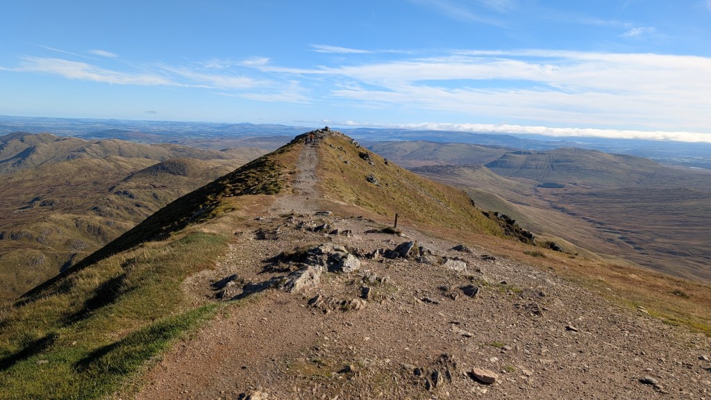 Hikers heading towards Stuc a' Chroin from the summit of Ben Vorlich. Credit: Julia Clarke