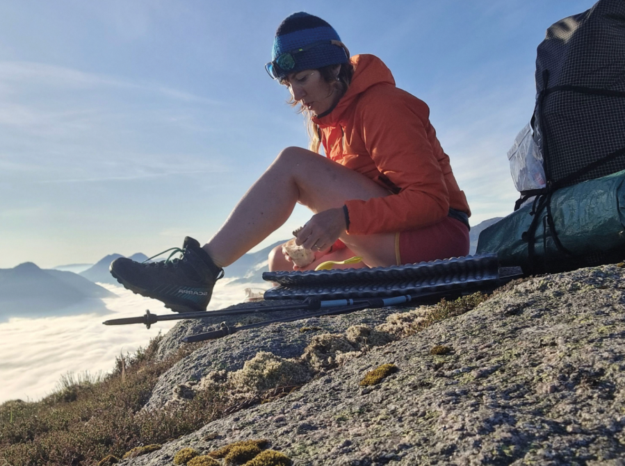 mountain women - A snack stop on Cul Mor for Sarah Jane. Credit: Dan Bailey