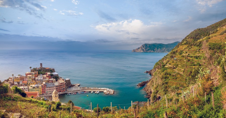 Hiking the trails of the Sentiero Azzuro above the picturesque village of Vernazza. Credit: LouieLea / Shutterstock