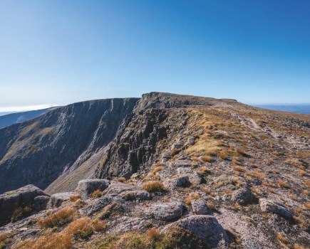 Dry, rocky mountain top with completely clear blue sky. The summit of Braeriach