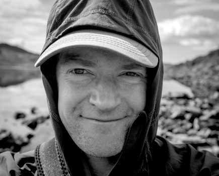 black and white portrait of David Lintern smiling